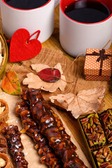 Wall Mural - Sweet food Turkish delight on wooden background, assorted locum and candy as decorated backdrop