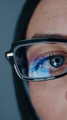 Poster - An extreme close-up of a blue eye framed by stylish glasses,