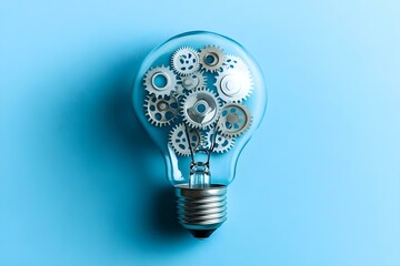 Wall Mural - a light bulb filled with metallic gears illustrates the concept of innovative ideas and creativity i