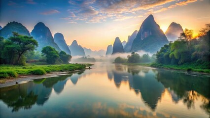 Canvas Print - Serene Sunrise over Misty River Valley with Karst Mountains Reflecting in Still Waters