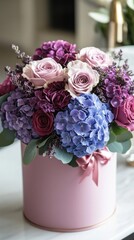 Poster - A stunning floral arrangement combines captivating pink roses, purple hydrangeas, and delicate accents in a large round pink box. Perfect for gifting or enhancing home ambiance