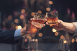 © Kritdanai - Whiskey Toast: Two hands in business attire raise glasses of amber whiskey in a celebratory toast against a softly blurred background of warm, festive lights.
