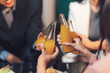 © Kritdanai - Cheers to Success! A group of colleagues raise their glasses in a celebratory toast, capturing the essence of teamwork, camaraderie, and shared achievement.