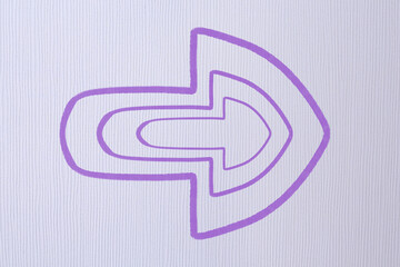 Wall Mural - one violet arrow on light grey textured background. pointer