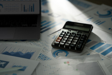 Poster - a person is using a calculator financial accounting business read report analysis graph data on pape