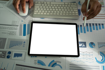 Poster - A businessman holds a mockup. iPad digital tablet with blank screen Mockup replaces your design mockup in the office.