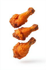 Wall Mural - Floating crispy fried chicken wings, isolated on white background.