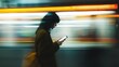 © Philipp - Woman uses phone on speeding train with blurred city lights backdrop, symbolizing modern commute and connectivity. Suitable for technology, urban lifestyle and travel themes.