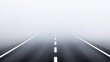 © DG - A straight road vanishes into thick fog, obscuring visibility and creating mystery and danger, highlighting the challenges and hazards of navigating such conditions.