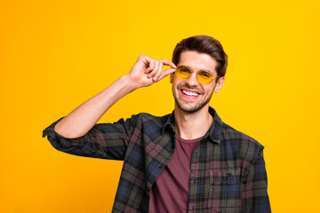 Wall Mural - Close up photo of funny guy ready for chilling and rejoicing wear casual plaid shirt isolated yellow color background