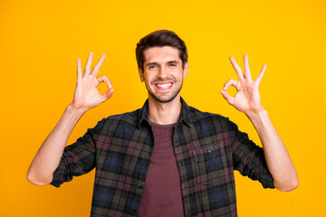 Poster - Photo of amazing macho guy showing okey symbols expressing positive mood wear casual plaid shirt isolated yellow color background