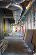 © Mint Images - A commercial building under construction with roof ducts and light gauge steel framing.
