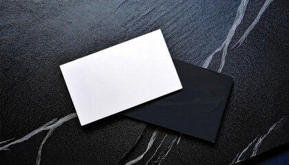 Poster - minimalist black and white business cards on textured black stone background for branding or graphic design mockup

