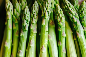 Wall Mural - Fresh green asparagus stalks in the market, vibrant and delicious. Perfect for a healthy meal or gourmet dish.