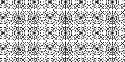 Black and white geometric spider web pattern with floral motif