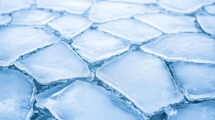 Poster - Floating blocks of ice create a captivating geometric pattern on the surface of a freezing lake, forming a stunning natural mosaic that showcases the beauty of winter