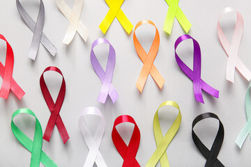 Wall Mural - Composition with different ribbons on grey background. World Cancer Day