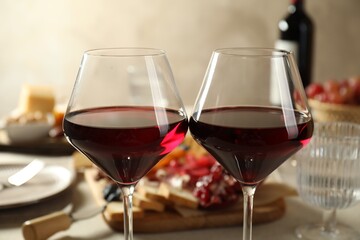 Canvas Print - Red wine and different snacks served on table, closeup