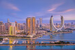 © hasan - Lusail, Qatar - December 20, 2024: Katara buildings view from Lusail Marina Park. Crescent Tower
