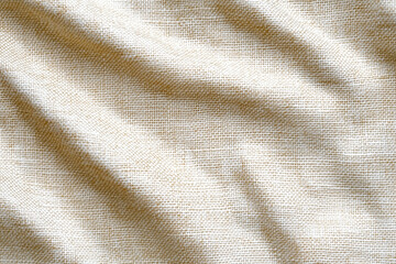 Poster - Natural beige fabric draping gently in soft light, showcasing texture and simplicity for design inspiration