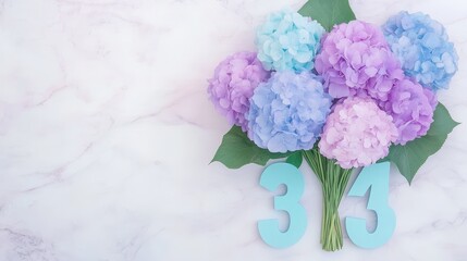 Canvas Print - Bouquet of Hydrangeas With Blue Number Cutouts on Marble Surface Flat Lay Style Arrangement.