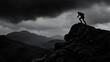 © Rastika - Silhouette of a person on a rocky peak with dark clouds and mountains in the background