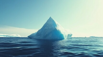 Wall Mural - a large iceberg floating in serene blue ocean waters under a clear sky.