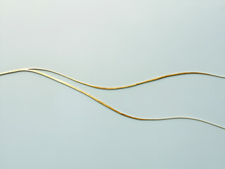 Poster - Golden Waves Abstract: Elegant, flowing lines of gold create a dynamic abstract design against a subtle, light-grey backdrop.  The image evokes feelings of sophistication, serenity, and movement. 