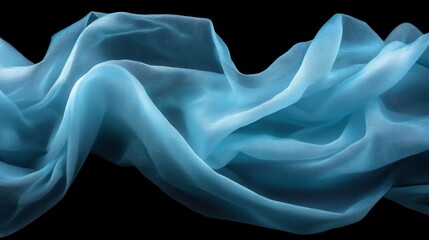 Poster - An elegant fabric draped gracefully, showcasing delicate flowing textures and light blue hues that evoke a sense of calm and tranquility against a black background.