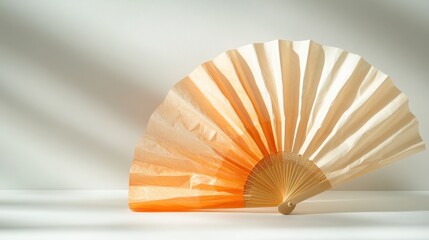 Aufkleber - A beautifully crafted paper fan featuring warm, soft hues that evoke a sense of elegance and tranquility, perfect for decorative purposes or cultural ceremonies.