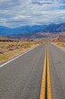 © Aquarius - A long desert road disappearing into the distant mountains of Arizona