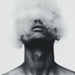 © walaiporn - A monochrome portrait of a man with his head obscured by swirling smoke, evoking themes of mystery and introspection.