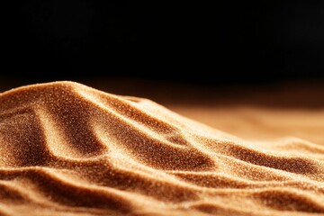 Poster - Golden sand dunes create beautiful patterns under soft light in a dark background