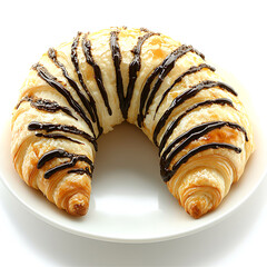 Wall Mural - Flaky, golden crescent pastry drizzled with dark chocolate stripes, presented on a crisp white plate.