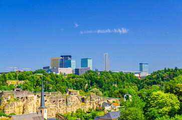 Wall Mural - Luxembourg City aerial panoramic view of Kirchberg central business district with skyscraper buildings and Three Acorns Park with green trees, Luxembourg cityscape skyline horizon with blue sky