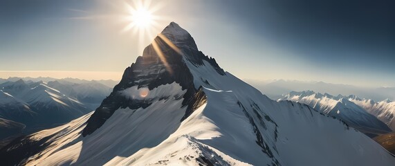 Wall Mural - A stunning view of a snow capped mountain peak illuminated by the bright sun celebrating the wonder and rugged beauty of natures landscapes