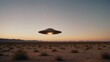 © demzp - Mysterious UFO hovers over desert landscape during sunset