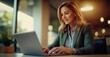 © Stock Pix - Professional woman working on a laptop, dressed in a blazer, focused on her screen in an office setting. Modern workplace scenario.