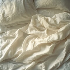Aufkleber - Morning light gently envelops an unmade bed with white sheets, revealing soft textures and subtle wrinkles. This unique aerial view invites tranquility and comfort into the space