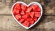 © Sawat - A heart-shaped fruit plate elegantly arranged with fresh watermelon slices.