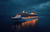 Luxury cruise ship sails at night on ocean. Illuminated ship moves smoothly. Vast ocean stretches out under dark sky. Vacation travel. Paradise travel. Ocean journey. Scenic view. Evening cruise. Big