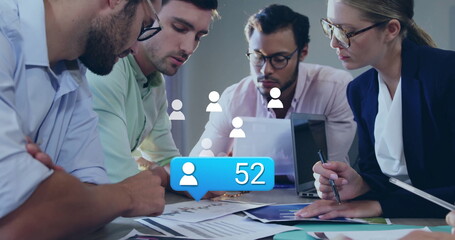 Poster - Image of social media icons with number over diverse colleagues having meeting in office