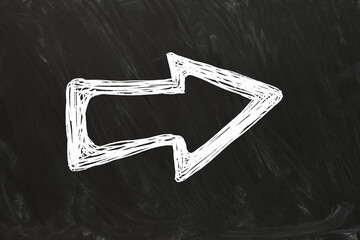 Wall Mural - one white arrow on black chalkboard. pointer
