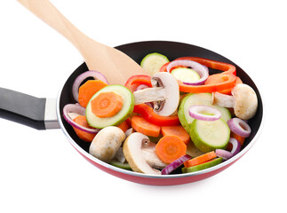 Wall Mural - Frying pan with mix of fresh vegetables, mushrooms and spatula isolated on white