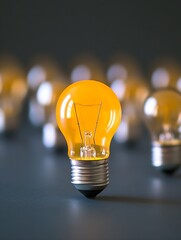 Aufkleber - Single Yellow Light Bulb Illuminating a Dark Background for Innovative Concepts : Generative AI
