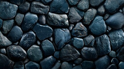 Poster - Dramatic and Moody Texture of Solid Black and Grey Stones or Rocks Forming a Natural Earthy Background in a Rugged Outdoor Landscape Environment