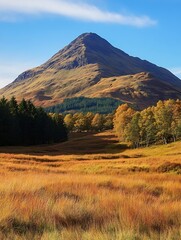 Poster - Stunning autumn landscape with a majestic mountain backdrop and vibrant golden grass fields : Generative AI