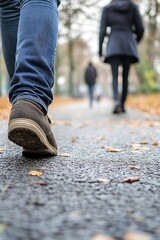 Poster - Perspective View of People Walking on a Path Covered with Fallen Leaves in Autumn : Generative AI