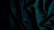 © Jantov - Textura de tela de terciopelo verde esmeralda. La imagen muestra un primer plano de la tela con pliegues y sombras, ideal para proyectos de diseño de interiores, moda y texturas. Imagen generada