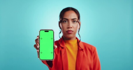 Poster - Hand, phone and green screen with woman in studio, face and mock up space with ui by blue background. Girl, person and smartphone with blank display, online and user experience on web in Costa Rica